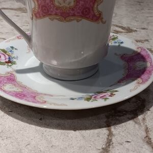 Remington fine china teacup and saucer set with a pink floral and gold trim